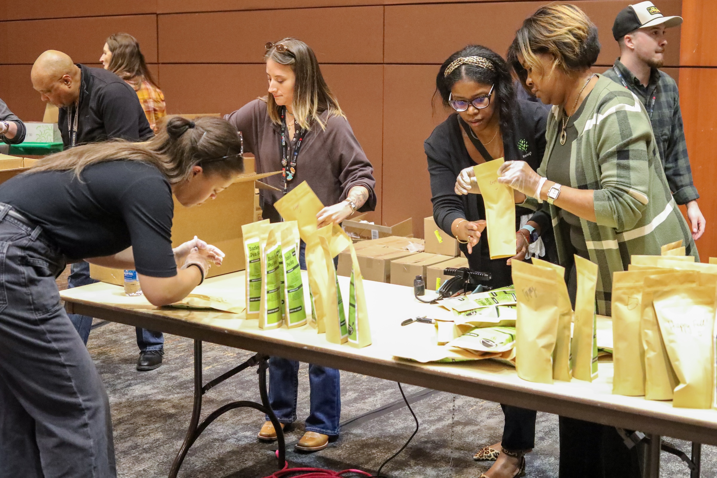 Volunteers packing soup ingredients