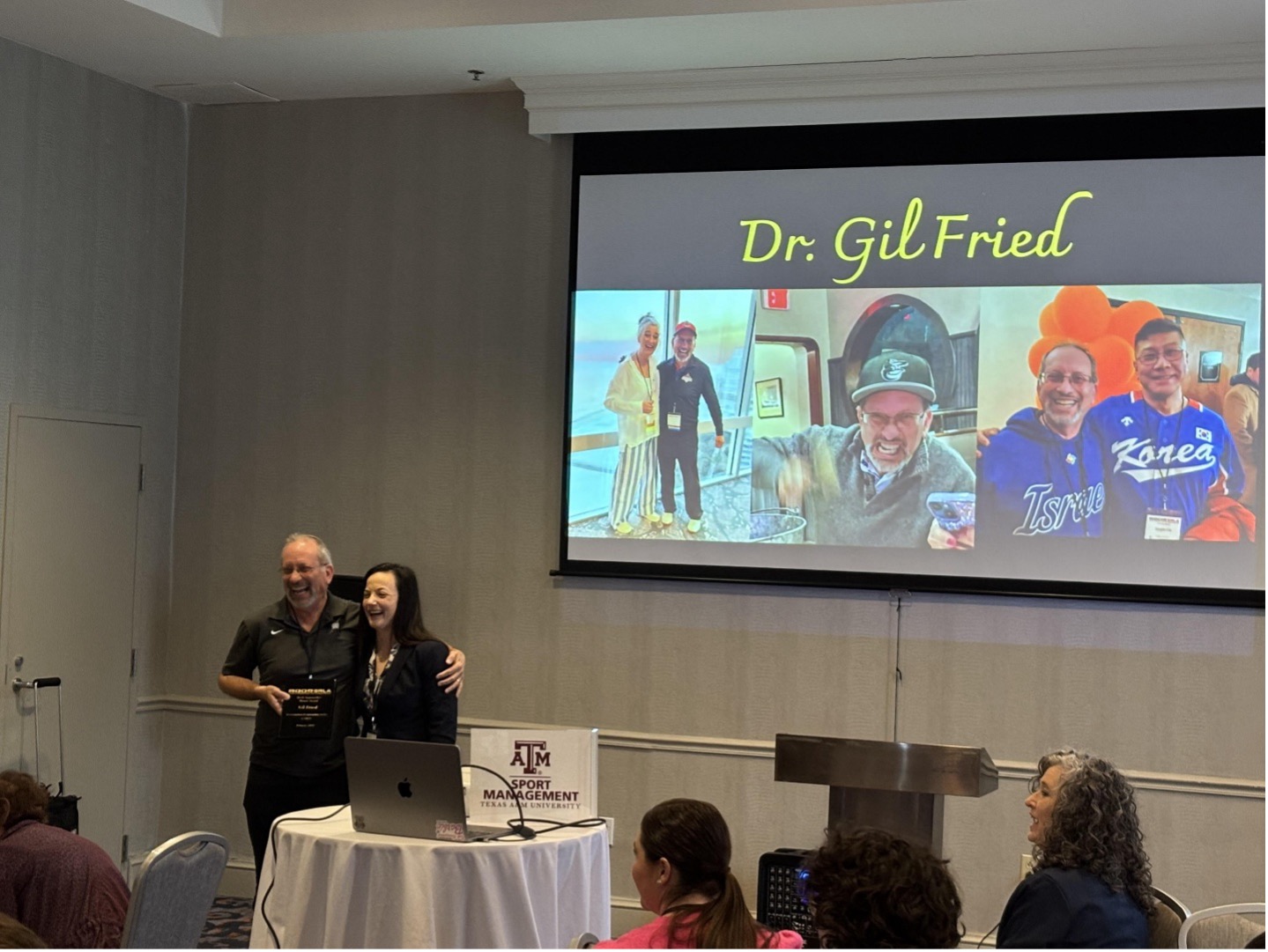 Dr. Gil Fried accepts award at SRLA conference