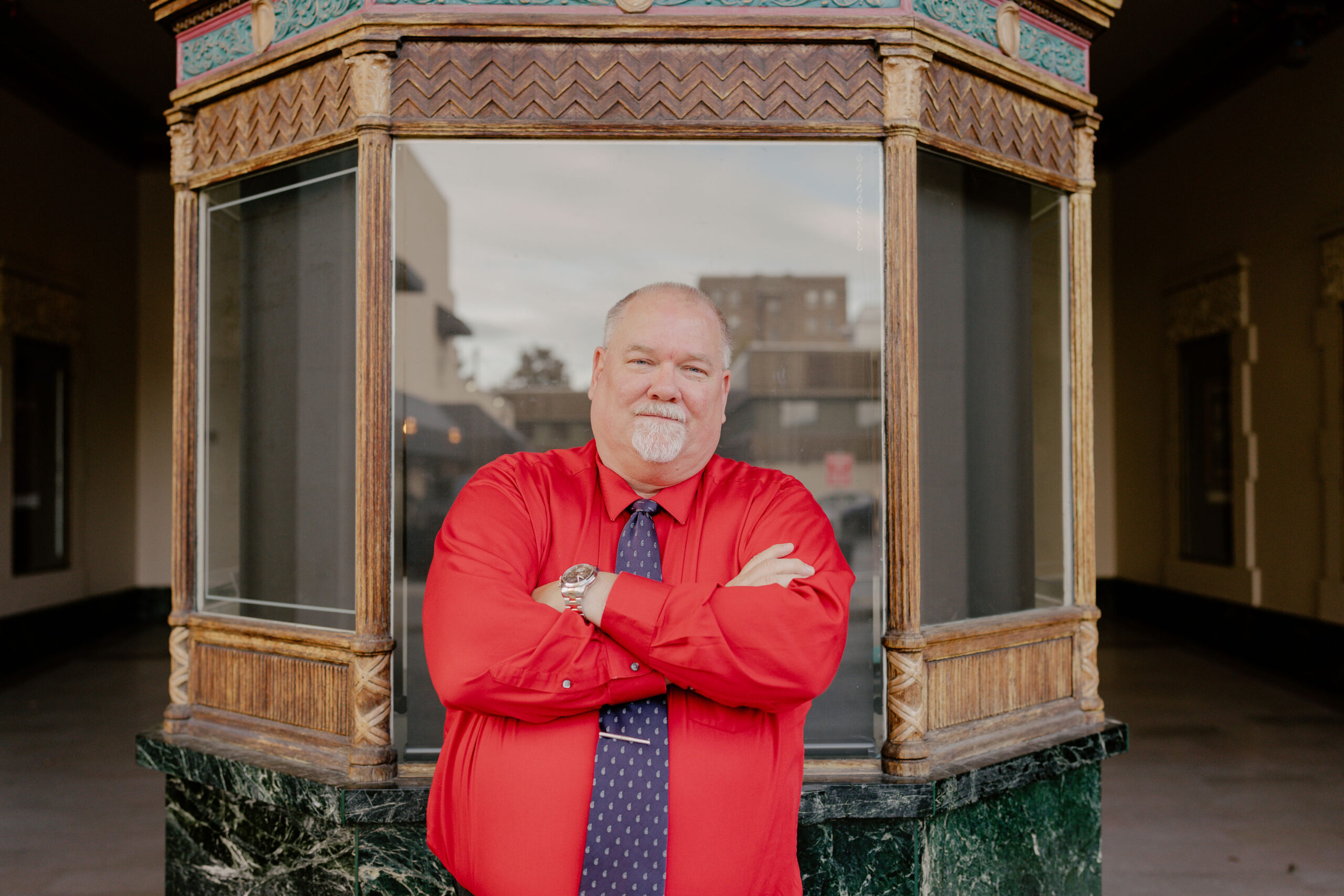 portrait of Jim Zoehrer in front of box office