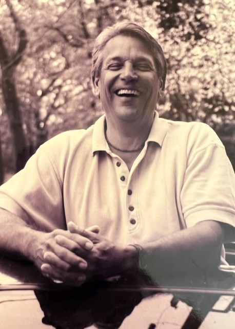 sepia portrait of John Bolin smiling
